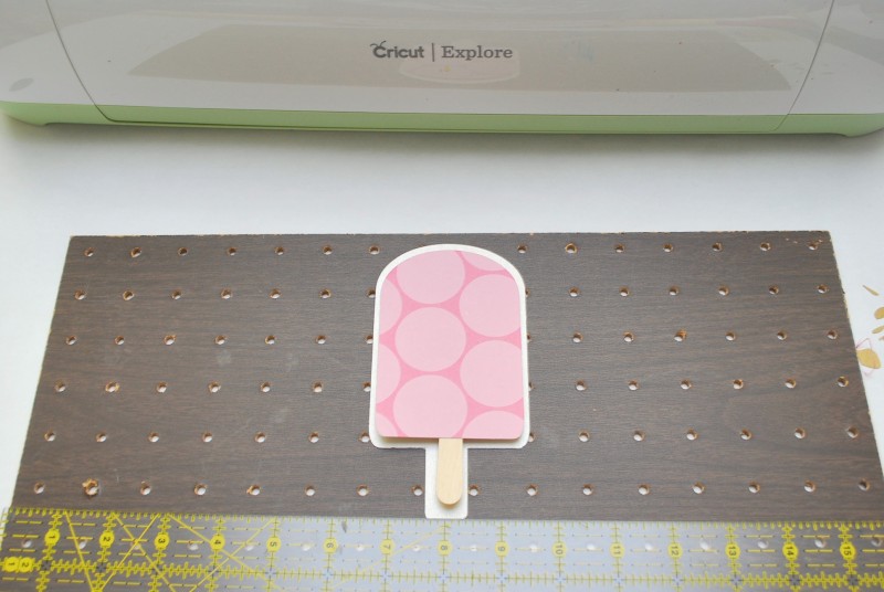 Centering popsicle on pegboard