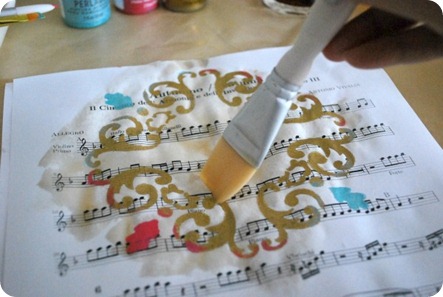 Applying tea stain to sheet music