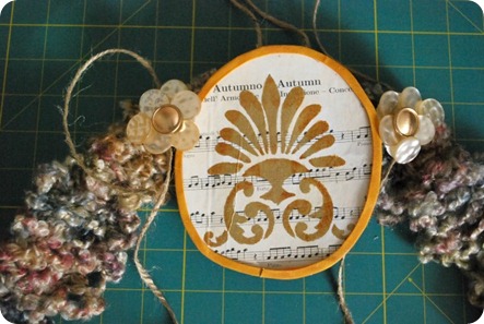 Attaching button accents to wreath