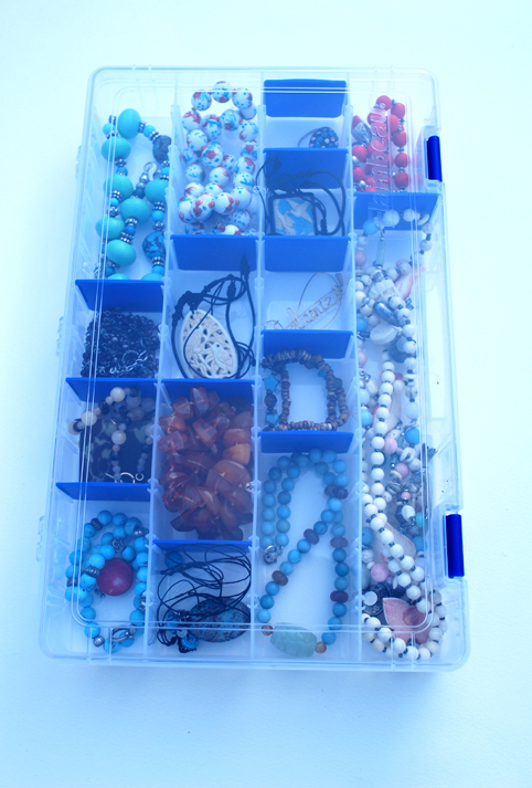 Organized jewelry in a tackle box container