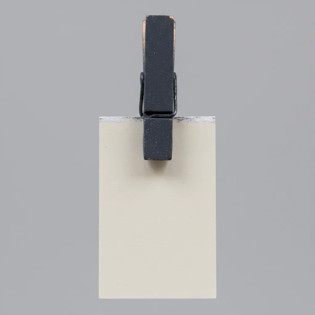 A clothespin painted with chalkboard paint holds a small tag with a guest's name written in chalk.