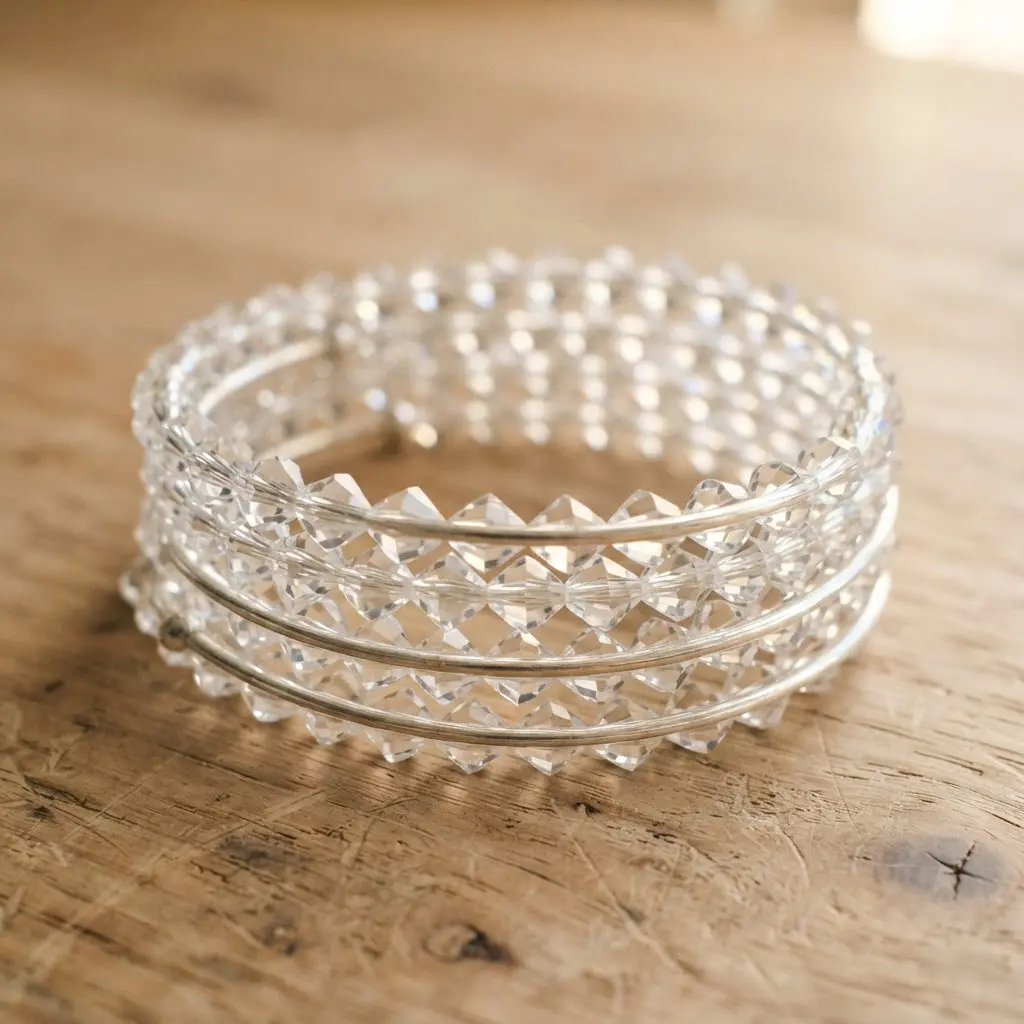 A sparkling memory wire bracelet densely strung with clear faceted bicone crystal beads that catch the light.